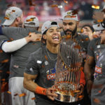 
              Houston Astros shortstop Jeremy Pena celebrates with the trophy after their 4-1 World Series win against the Philadelphia Phillies in Game 6 on Saturday, Nov. 5, 2022, in Houston. (AP Photo/David J. Phillip)
            