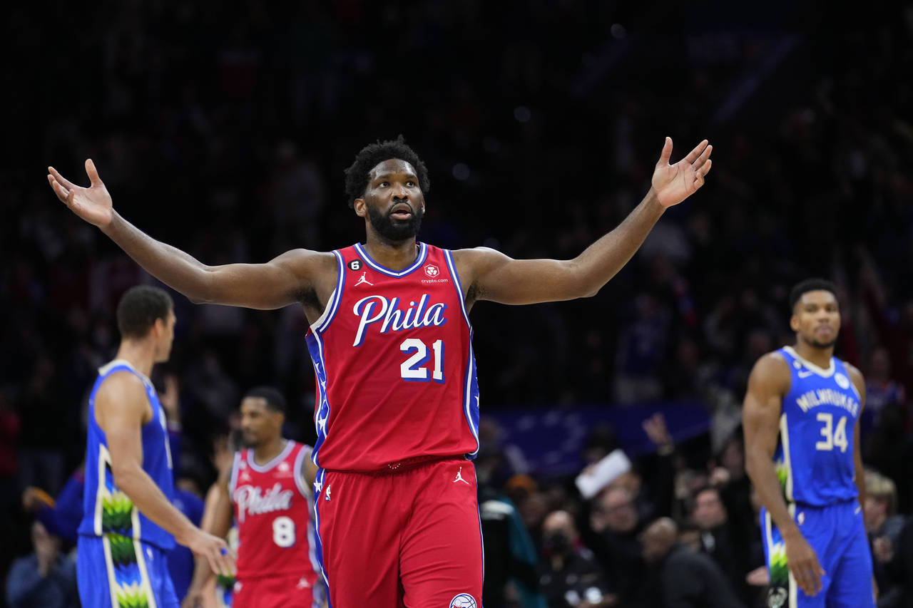 Philadelphia 76ers' Joel Embiid reacts during the second half of an NBA basketball game against the...