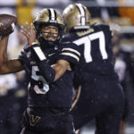 
              Vanderbilt quarterback Mike Wright (5) throws to a receiver during the first half of the team's NCAA college football game against Tennessee, Saturday, Nov. 26, 2022, in Nashville, Tenn. (AP Photo/Wade Payne)
            
