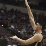 
              Purdue center Zach Edey (15) shoots over Florida State forward Cameron Corhen (3) during the first half of an NCAA college basketball game in Tallahassee, Fla., Wednesday, Nov. 30, 2022. (AP Photo/Phil Sears)
            