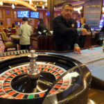 
              A dealer conducts a game of roulette at the Hard Rock Casino in Atlantic City, N.J., on Aug. 8, 2022. Figures released on Nov. 9, 2022, by the American Gaming Association show the U.S. commercial casino industry had its best quarter ever, winning over $15 billion from gamblers in the third quarter of this year. (AP Photo/Wayne Parry)
            