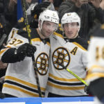 
              Boston Bruins center Patrice Bergeron (37) celebrates with left wing Brad Marchand (63) after Bergeron assisted on Marchand's goal during the second period of an NHL hockey game against the Tampa Bay Lightning Monday, Nov. 21, 2022, in Tampa, Fla. (AP Photo/Chris O'Meara)
            