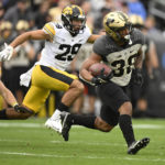 
              Purdue running back Dylan Downing (38) runs the ball during the second half of an NCAA college football game against Iowa, Saturday, Nov. 5, 2022, in West Lafayette, Ind. (AP Photo/Marc Lebryk)
            