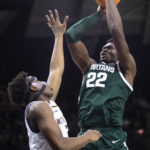 
              Michigan State's Mady Sissoko (22) shoots over Notre Dame's Ven-Allen Lubin during the first half of an NCAA college basketball game Wednesday, Nov. 30, 2022, in South Bend, Ind. (AP Photo/Michael Caterina)
            
