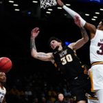 
              Virginia Commonwealth's Brandon Johns Jr. (30) loses control of the ball as he drives past Arizona State's Alonzo Gaffney (32) during the second half of an NCAA college basketball game at the Legends Classic Wednesday, Nov. 16, 2022, in New York. Arizona State won 63-59. (AP Photo/Frank Franklin II)
            