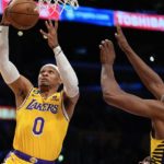 
              Los Angeles Lakers guard Russell Westbrook, left, shoots as Indiana Pacers center Myles Turner defends during the first half of an NBA basketball game Monday, Nov. 28, 2022, in Los Angeles. (AP Photo/Mark J. Terrill)
            