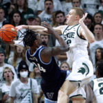 
              Michigan State's Joey Hauser, right, blocks the shot of Villanova's Brandon Slater (34) during the second half of an NCAA college basketball game Friday, Nov. 18, 2022, in East Lansing, Mich. Michigan State won 73-71. (AP Photo/Al Goldis)
            