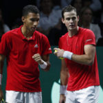 
              Canada's Vasek Pospisil, right, speaks to Felix Auger Aliassime during the semi-final Davis Cup tennis doubles match between Italy and Canada in Malaga, Spain, Saturday, Nov. 26, 2022. (AP Photo/Joan Monfort)
            