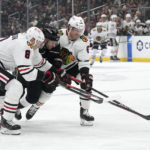 
              Los Angeles Kings right wing Gabriel Vilardi, center, gets sandwiched between Chicago Blackhawks defenseman Jack Johnson, left, and defenseman Jake McCabe during the second period of an NHL hockey game Thursday, Nov. 10, 2022, in Los Angeles. (AP Photo/Mark J. Terrill)
            
