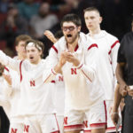 
              Alongside teammates on the bench, Nebraska's Wilhelm Breidenbach, second from front right, celebrates after a 3-point basket against Arkansas-Pine Bluff during the second half of an NCAA college basketball game on Sunday, Nov. 20, 2022, in Lincoln, Neb. (AP Photo/Rebecca S. Gratz)
            