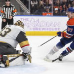 
              Vegas Golden Knights' goalie Adin Hill (33) gives up a goal to Edmonton Oilers' Connor McDavid (97) during overtime in an NHL hockey game Saturday, Nov. 19, 2022, in Edmonton, Alberta. (Jason Franson/The Canadian Press via AP)
            