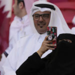 
              A Qatar team supporter takes pictures prior to the start of the World Cup group A soccer match between Qatar and Senegal, at the Al Thumama Stadium in Doha, Qatar, Friday, Nov. 25, 2022. (AP Photo/Thanassis Stavrakis)
            