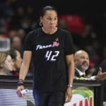 
              South Carolina coach Dawn Staley, wearing a T-shirt calling attention to Brittney Griner, watches during the second half of the team's NCAA college basketball game against Maryland, Friday, Nov. 11, 2022, in College Park, Md. South Carolina won 81-56. (AP Photo/Gail Burton)
            