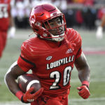 
              Louisville running back Maurice Turner (20) advances the ball during the first half of an NCAA college football game against North Carolina State in Louisville, Ky., Saturday, Nov. 19, 2022. (AP Photo/Timothy D. Easley)
            