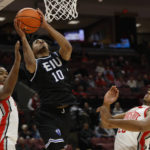 
              Eastern Illinois' Kinyon Hodges, center, shoots between Ohio State's Brice Sensabaugh, left, and Zed Key during the first half of an NCAA college basketball game Wednesday, Nov. 16, 2022, in Columbus, Ohio. (AP Photo/Jay LaPrete)
            