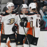 
              Anaheim Ducks center Ryan Strome, middle, is congratulated by defenseman John Klingberg, left, and right wing Troy Terry (19) after scoring against the San Jose Sharks during the second period of an NHL hockey game in San Jose, Calif., Tuesday, Nov. 1, 2022. (AP Photo/Jeff Chiu)
            