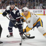 
              Colorado Avalanche forward Shane Bowers, left, and Nashville Predators center Mark Jankowski watch the puck bounce away during the first period of an NHL hockey game Thursday, Nov. 10, 2022, in Denver. (AP Photo/David Zalubowski)
            