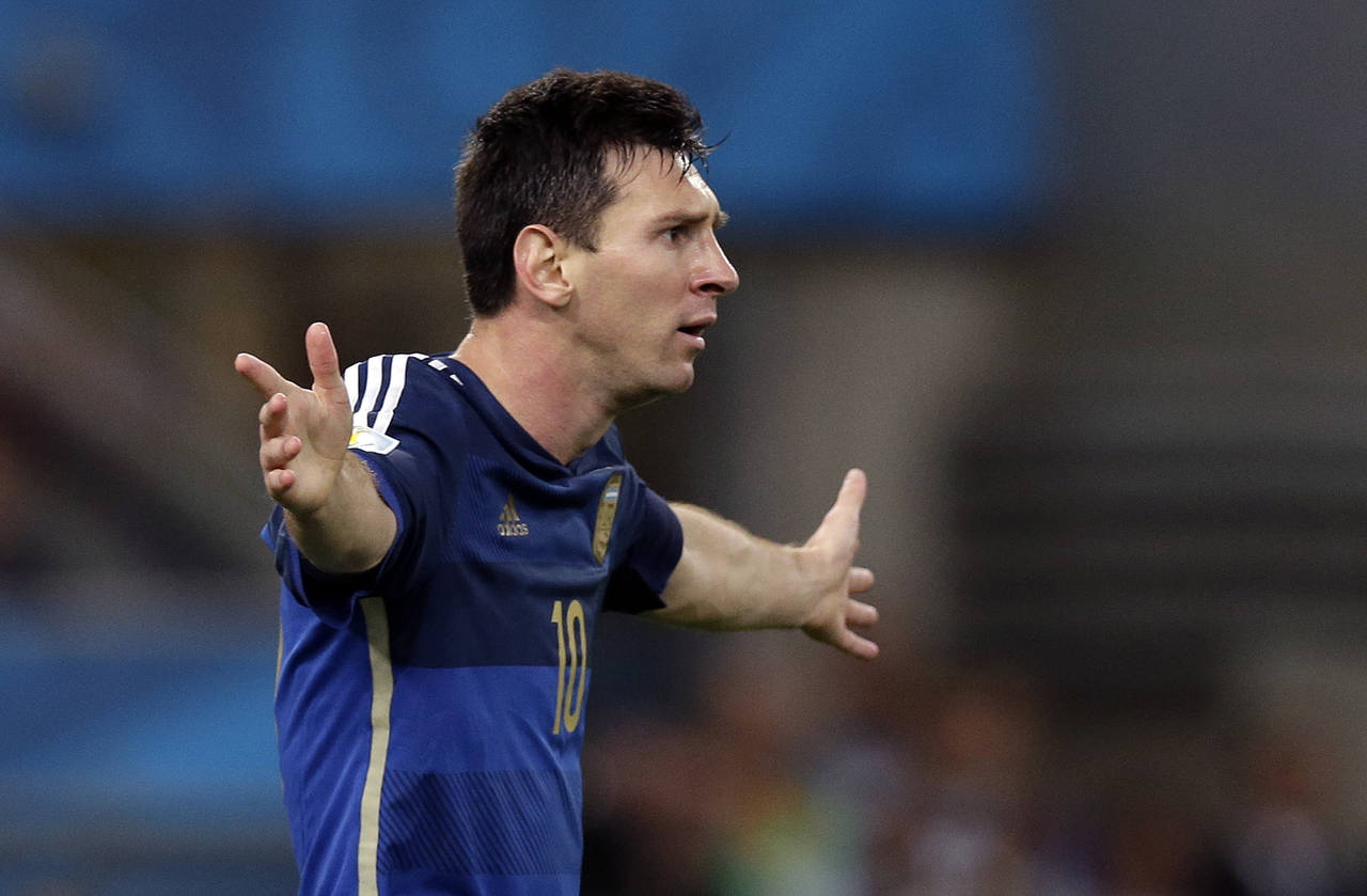 FILE - Argentina's Lionel Messi reacts during the World Cup final soccer match between Germany and ...