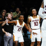 
              Arizona State's DJ Horne (0) and Frankie Collins (10) cheer for their teammates during the second half of an NCAA college basketball game against Michigan in the championship round of the Legends Classic Thursday, Nov. 17, 2022, in New York. Arizona State won 87-62. (AP Photo/Frank Franklin II)
            