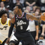 
              Utah Jazz guard Collin Sexton (2) defends Los Angeles Clippers guard John Wall (11) during the first half of an NBA basketball game Wednesday, Nov. 30, 2022, in Salt Lake City. (AP Photo/Rick Bowmer)
            