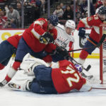 
              Florida Panthers goaltender Sergei Bobrovsky (72) stops a shot on goal by Washington Capitals center Joe Snively (91) during the first period of an NHL hockey game, Tuesday, Nov. 15, 2022, in Sunrise, Fla. (AP Photo/Marta Lavandier)
            