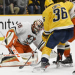 
              Anaheim Ducks goaltender John Gibson (36) reaches for the puck after a shot on goal by the Nashville Predators during the second period of an NHL hockey game Tuesday, Nov. 29, 2022, in Nashville, Tenn. (AP Photo/Mark Zaleski)
            