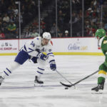 
              Toronto Maple Leafs center Auston Matthews (34) goes after the puck against Minnesota Wild defenseman Jake Middleton (5) during the second period of an NHL hockey game Friday, Nov. 25, 2022, in St. Paul, Minn. (AP Photo/Stacy Bengs)
            