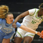 
              North Carolina guard Alyssa Ustby, left, and Oregon center Phillipina Kyei (15) battle for the ball during the first half of an NCAA college basketball game in the Phil Knight Invitational tournament Thursday, Nov. 24, 2022, in Portland, Ore. (AP Photo/Rick Bowmer)
            