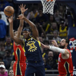 
              Indiana Pacers center Myles Turner (33) passes away the ball during the second quarter of an NBA Basketball game against the New Orleans Pelicans, Monday, Nov. 7, 2022, in Indianapolis, Ind. (AP Photo/Marc Lebryk)
            