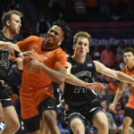 
              Illinois' Terrence Shannon Jr., second from left, works the ball inside against Monmouth's Klemen Vuga (35) and Jack Holmstrom during the first half of an NCAA college basketball game, Monday, Nov. 14, 2022, in Champaign, Ill. (AP Photo/Michael Allio)
            