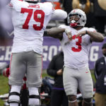 
              Ohio State running back Miyan Williams, right, celebrates with offensive lineman Dawand Jones after scoring a touchdown during the second half of an NCAA college football game against Northwestern, Saturday, Nov. 5, 2022, in Evanston, Ill. Ohio State won 21-7. (AP Photo/Nam Y. Huh)
            