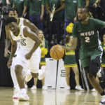 
              Mississippi Valley State guard Arecko Gipson (2), runs up court past Baylor guard Adam Flagler (10), in the first half of an NCAA college basketball game, Monday, Nov. 7, 2022, in Waco, Texas. (AP Photo/Rod Aydelotte)
            
