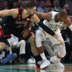 
              Chicago Bulls' Nikola Vucevic (9) battles Boston Celtics' Al Horford for the ball during the first half of an NBA basketball game, Friday, Nov 4, 2022, in Boston. (AP Photo/Michael Dwyer)
            