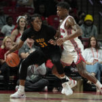 
              Norfolk State guard Cahiem Brown (31) is defended by Houston guard Marcus Sasser during the first half of an NCAA college basketball game, Tuesday, Nov. 29, 2022, in Houston. (AP Photo/Kevin M. Cox)
            