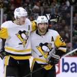 
              Pittsburgh Penguins defenseman Kris Letang (58) is congratulated by Evgeni Malkin (71) after scoring a goal against the Minnesota Wild during the second period of an NHL hockey game Thursday, Nov. 17, 2022, in St. Paul, Minn. (AP Photo/Andy Clayton-King)
            