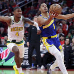 
              Golden State Warriors guard Jordan Poole (3) starts a layup in front of Houston Rockets guard Jalen Green (4) during the first half of an NBA basketball game Sunday, Nov. 20, 2022, in Houston. (AP Photo/Michael Wyke)
            
