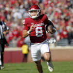 
              Oklahoma quarterback Dillon Gabriel carries the ball in the first half of an NCAA college football game against Baylor, Saturday, Nov. 5, 2022 in Norman, Okla. (AP Photo/Nate Billings)
            