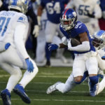 
              New York Giants wide receiver Darius Slayton (86) runs the ball against Detroit Lions cornerback Jerry Jacobs (39) during the second half of an NFL football game, Sunday, Nov. 20, 2022, in East Rutherford, N.J. (AP Photo/Seth Wenig)
            