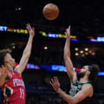 
              Boston Celtics guard Derrick White shoots against New Orleans Pelicans guard Dyson Daniels (11) in the second half of an NBA basketball game in New Orleans, Friday, Nov. 18, 2022. The Celtics won 117-109. (AP Photo/Gerald Herbert)
            