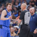 
              Dallas Mavericks point guard Luka Doncic (77) argues a foul call while head coach Jason Kidd, right, looks on during the second half of an NBA basketball game against the Denver Nuggets, Friday, Nov. 18, 2022, in Dallas. (AP Photo/Gareth Patterson)
            