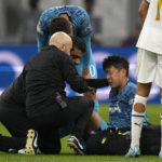 
              FILE - Tottenham' s Son Heung-min receives treatment after taking a knock during the Champions League Group D soccer match between Marseille and Tottenham Hotspur at the Stade Velodrome in Marseille, France, Tuesday, Nov. 1, 2022. When Son Heung-min went down clutching his face in Tottenham’s Champions League match with Marseille last week the pain was not confined to his fractured eye socket. The shockwaves were felt all the way back in his homeland South Korea as the nation feared the worst ahead of the World Cup. (AP Photo/Daniel Cole, File)
            