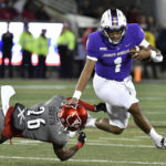 
              James Madison quarterback Todd Centeio (1) avoids the tackle attempt by Louisville safety M.J. Griffin (26) during the first half of an NCAA college football game in Louisville, Ky., Saturday, Nov. 5, 2022. (AP Photo/Timothy D. Easley)
            