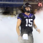 
              FILE - TCU quarterback Max Duggan (15) stands at a tunnel exit during team introductions before an NCAA college football game against Kansas State in Fort Worth, Texas, on Oct. 22, 2022. Duggan’s 41st career start for third-ranked TCU will come in the Big 12 championship game on Saturday, Dec, 3, 2022, with the undefeated Horned Frogs on the brink of making the College Football Playoff. (AP Photo/Richard W. Rodriguez, File)
            