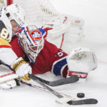 
              Montreal Canadiens goaltender Jake Allen stops Vegas Golden Knights' Jonathan Marchessault during the third period of an NHL hockey game Saturday, Nov. 5, 2022, in Montreal. (Graham Hughes/The Canadian Press via AP)
            