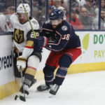 
              Columbus Blue Jackets' Boone Jenner, right, checks Vegas Golden Knights' William Carrier during the third period of an NHL hockey game on Monday, Nov. 28, 2022, in Columbus, Ohio. (AP Photo/Jay LaPrete)
            