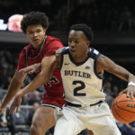 
              Butler's Eric Hunter Jr. (2) is defended by Saint Francis' Landon Moore (14) during the first half of an NCAA college basketball game Thursday, Nov. 17, 2022, in Indianapolis. (AP Photo/Darron Cummings)
            