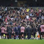 
              Brentford players celebrate at the end of the English Premier League soccer match between Manchester City and Brentford, at the Etihad stadium in Manchester, England, Saturday, Nov.12, 2022. Brentford won 2-1. (AP Photo/Dave Thompson)
            