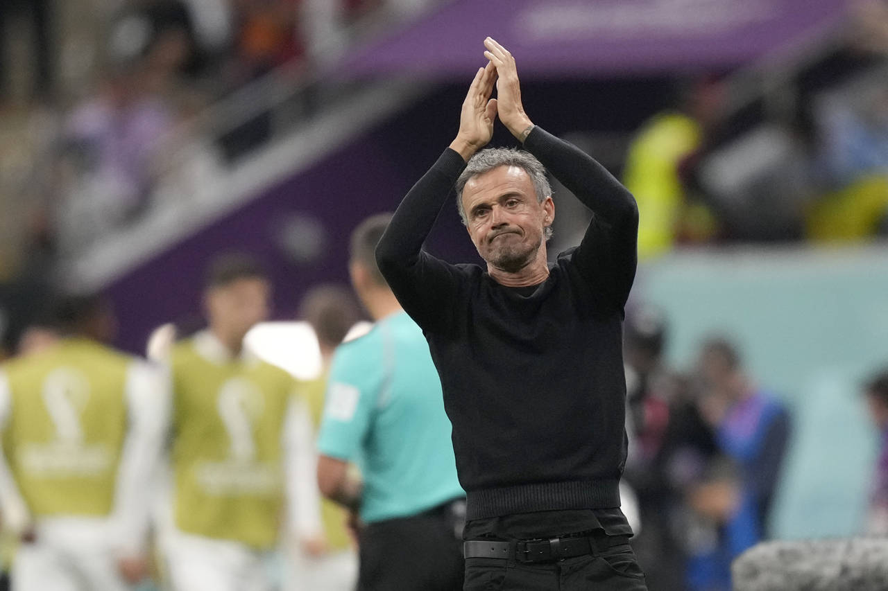 Spain's head coach Luis Enrique claps his hands during the World Cup group E soccer match between S...