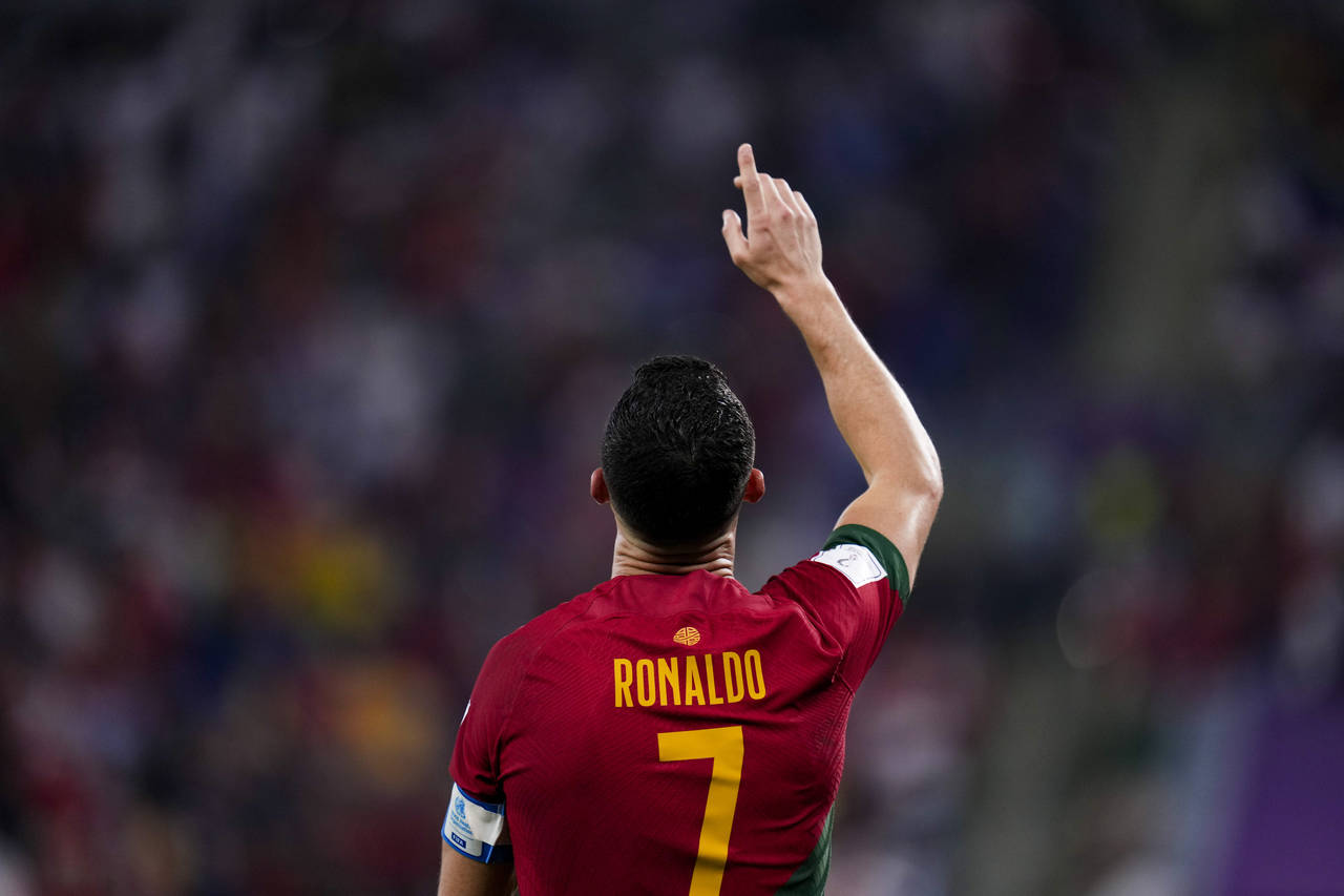 Portugal's Cristiano Ronaldo celebrates after scoring from the penalty spot his side's opening goal...