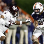 
              Auburn tight end Tyler Fromm (85) carries the ball as Texas A&M linebacker Andre White Jr. (32) defends during the first half of an NCAA college football game, Saturday, Nov. 12, 2022, in Auburn, Ala. (AP Photo/Butch Dill)
            